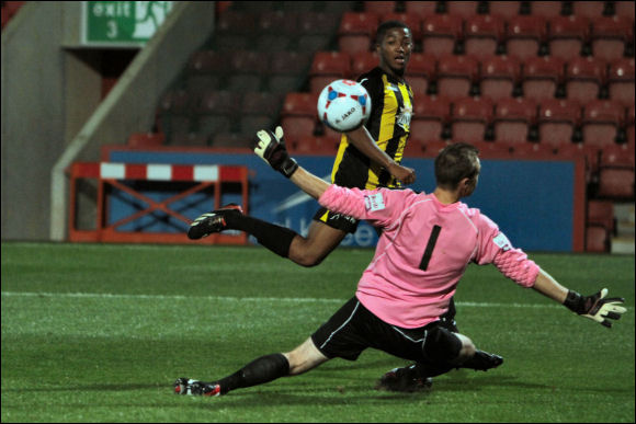 Scott Wilson lifts a shot over Worcester keeper Matt Sargeant to make it 2-0