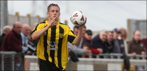 Player of the season candidate Lee Marshall takes a throw-in against Yate